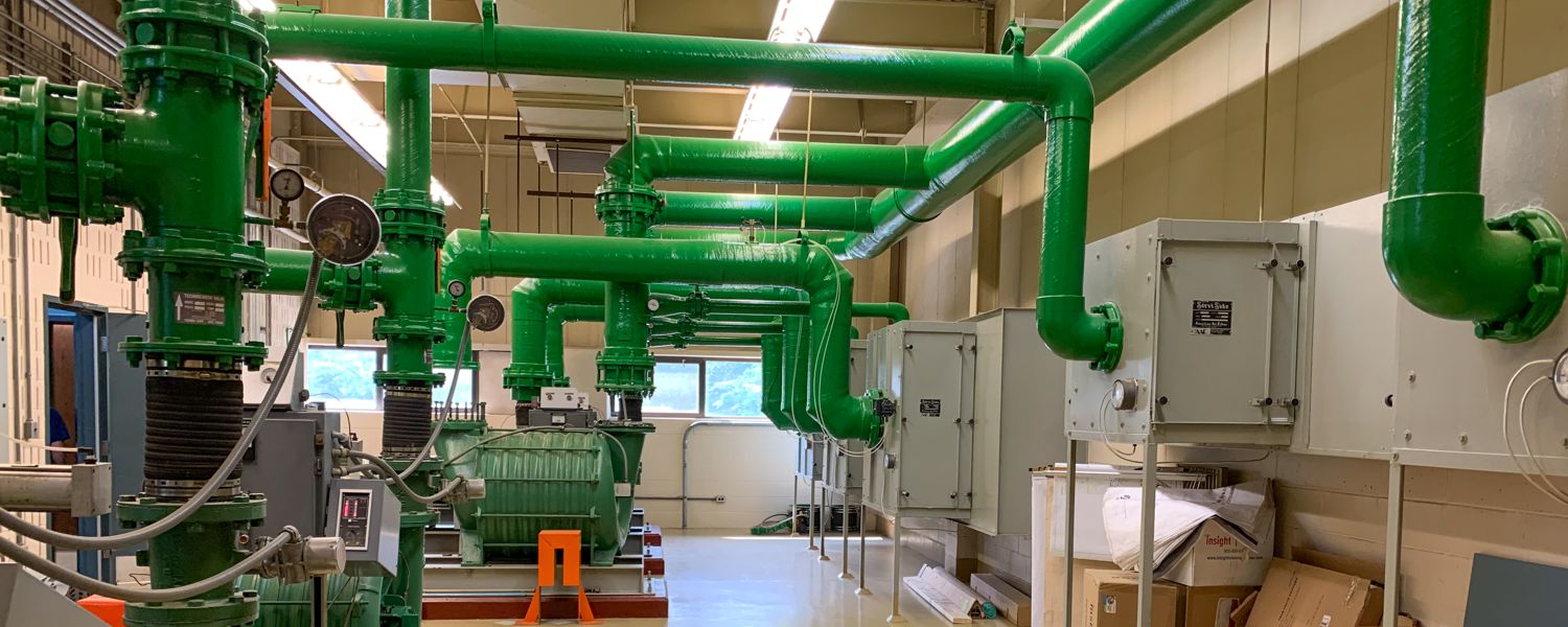 inside wwtf plant with green pipes