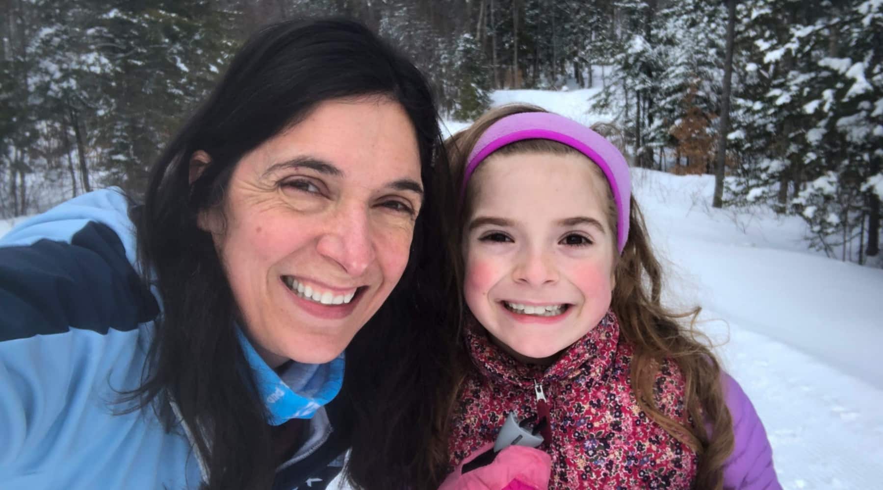 An employee spotlight on Alyssa Smith who is pictured here, outside taking a selfie with her daughter.