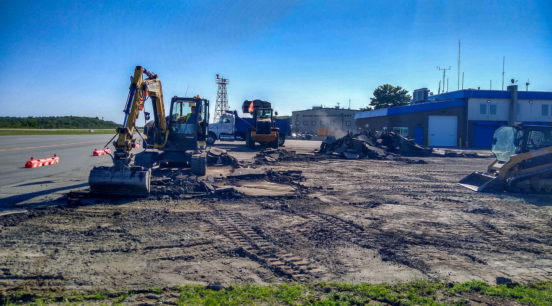 Airport construction photo at Augusta Airport with dug dirt in the foreground and blue skies.