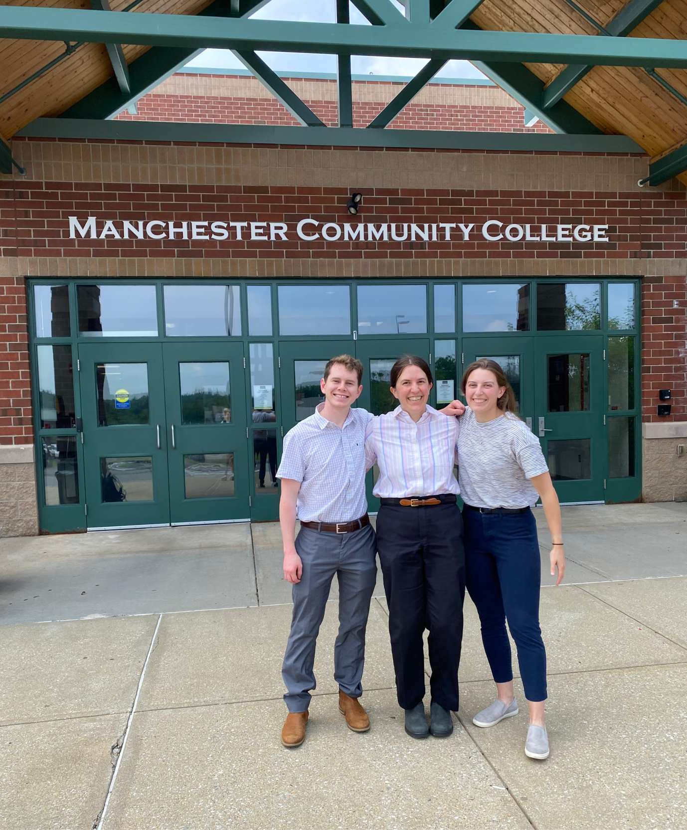 Stephanie Bishop, Lynne Sanbourin an JJ Hollstein outside Manchester Community College