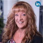 Stacie Haskell corporate headshot with LinkedIn symbol in upper corner