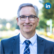 Paul Hobbs corporate headshot with LinkedIn logo in upper corner