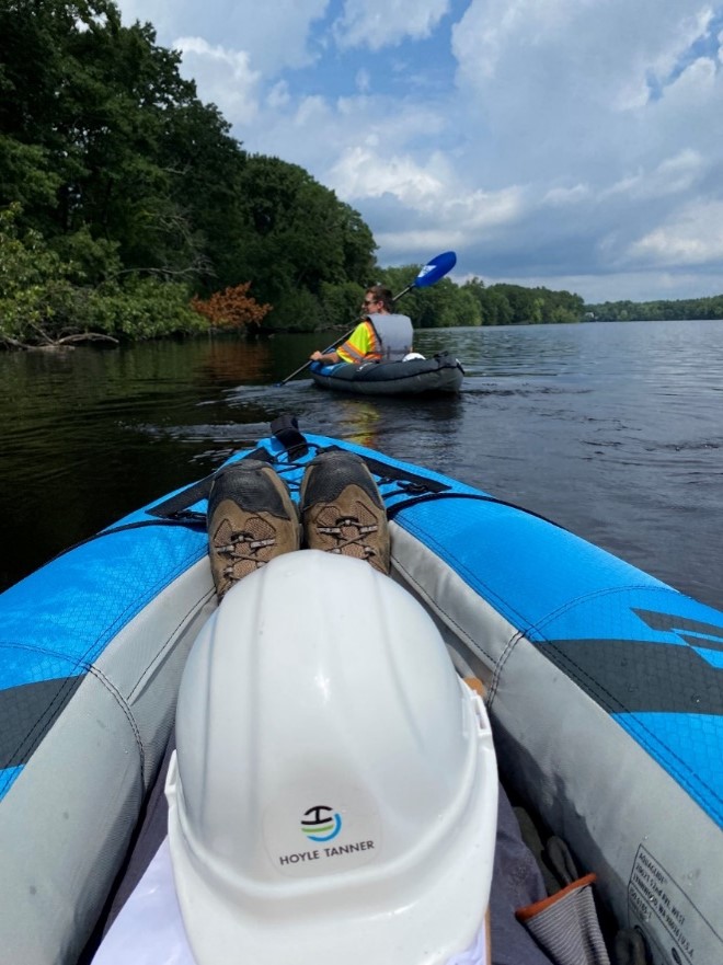 Two Hoyle Tanner engineers in kayaks on the river in Chelmsford, MA after inspecting various culverts.