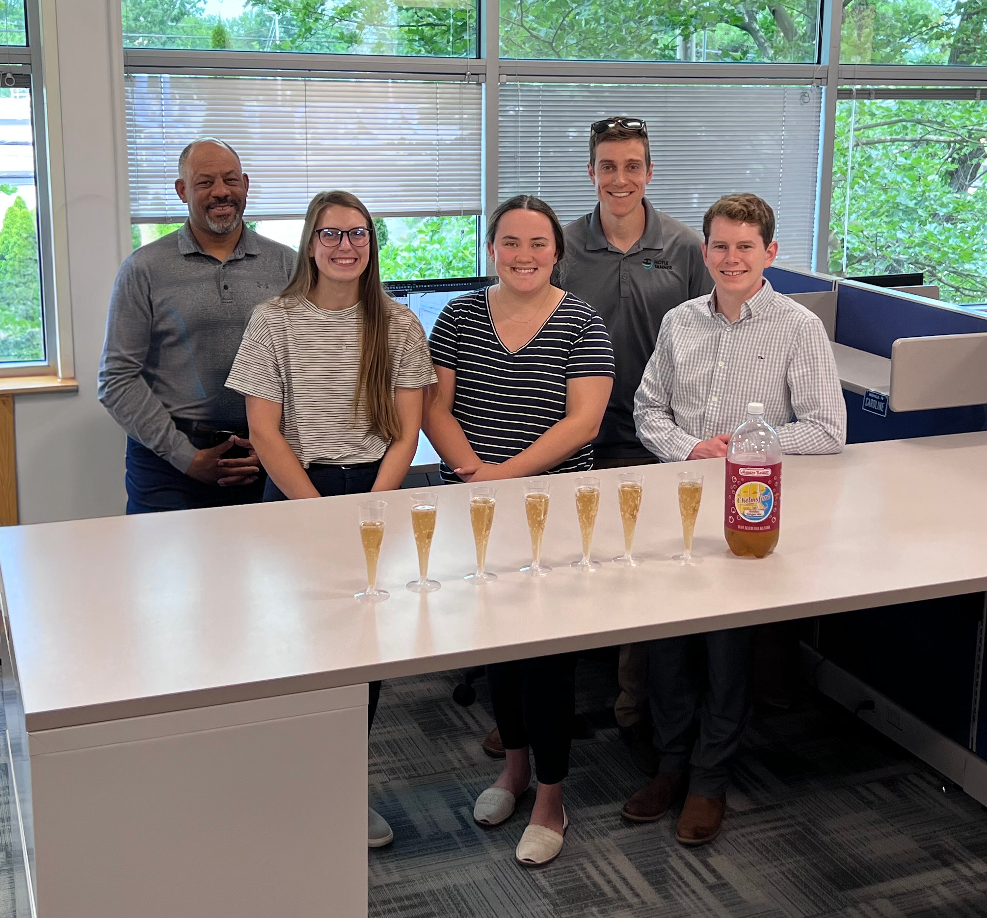 Staff toasts with the local Chelmsford Ginger Ale in the Chelmsford office.