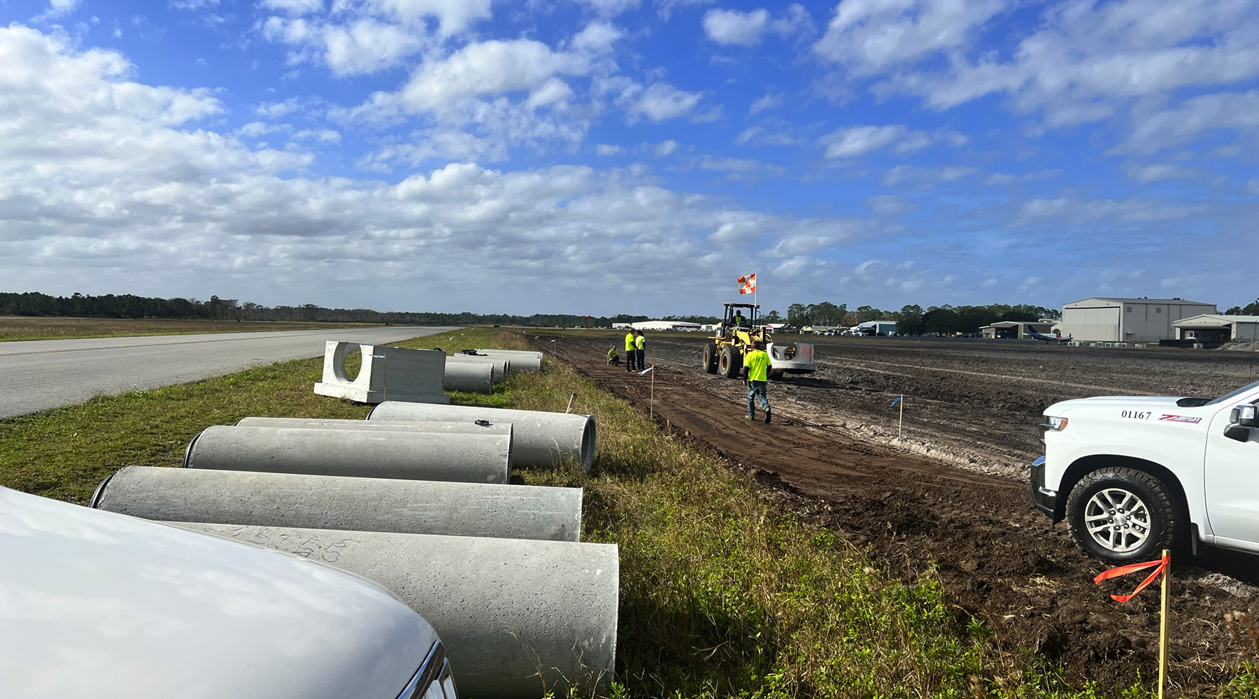 Photo during a sunny day of construction work at Flagler County Airport