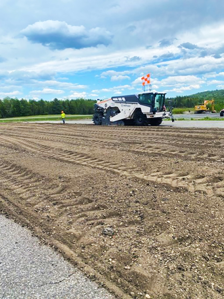 Full Depth Recycling of existing asphalt to be reused as base gravel material.