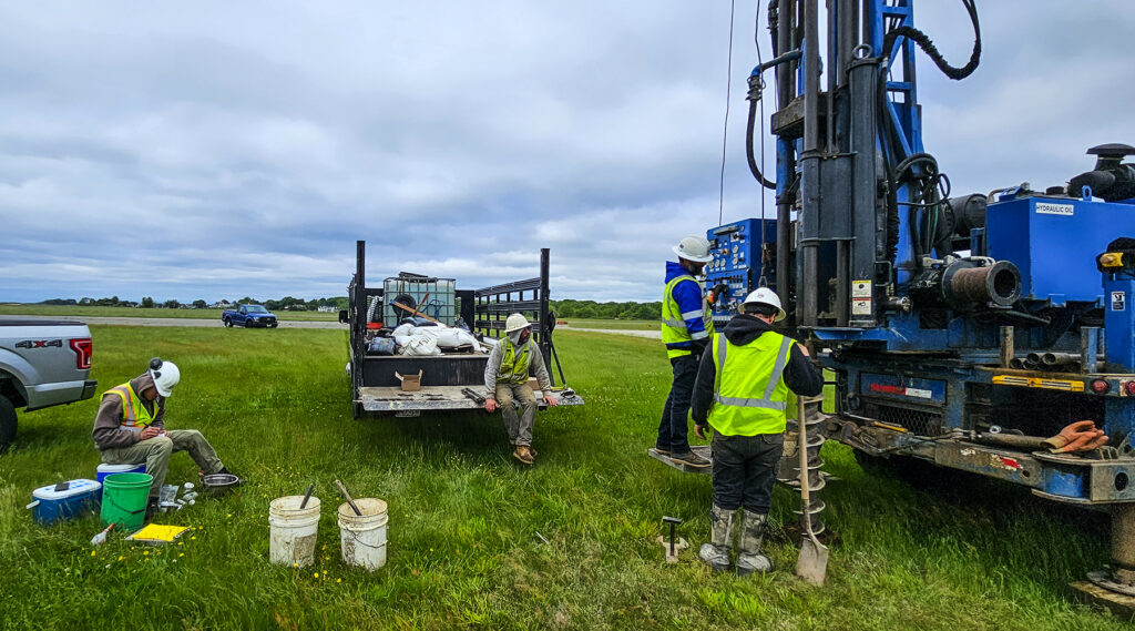 Construction workers on break at an airfield.