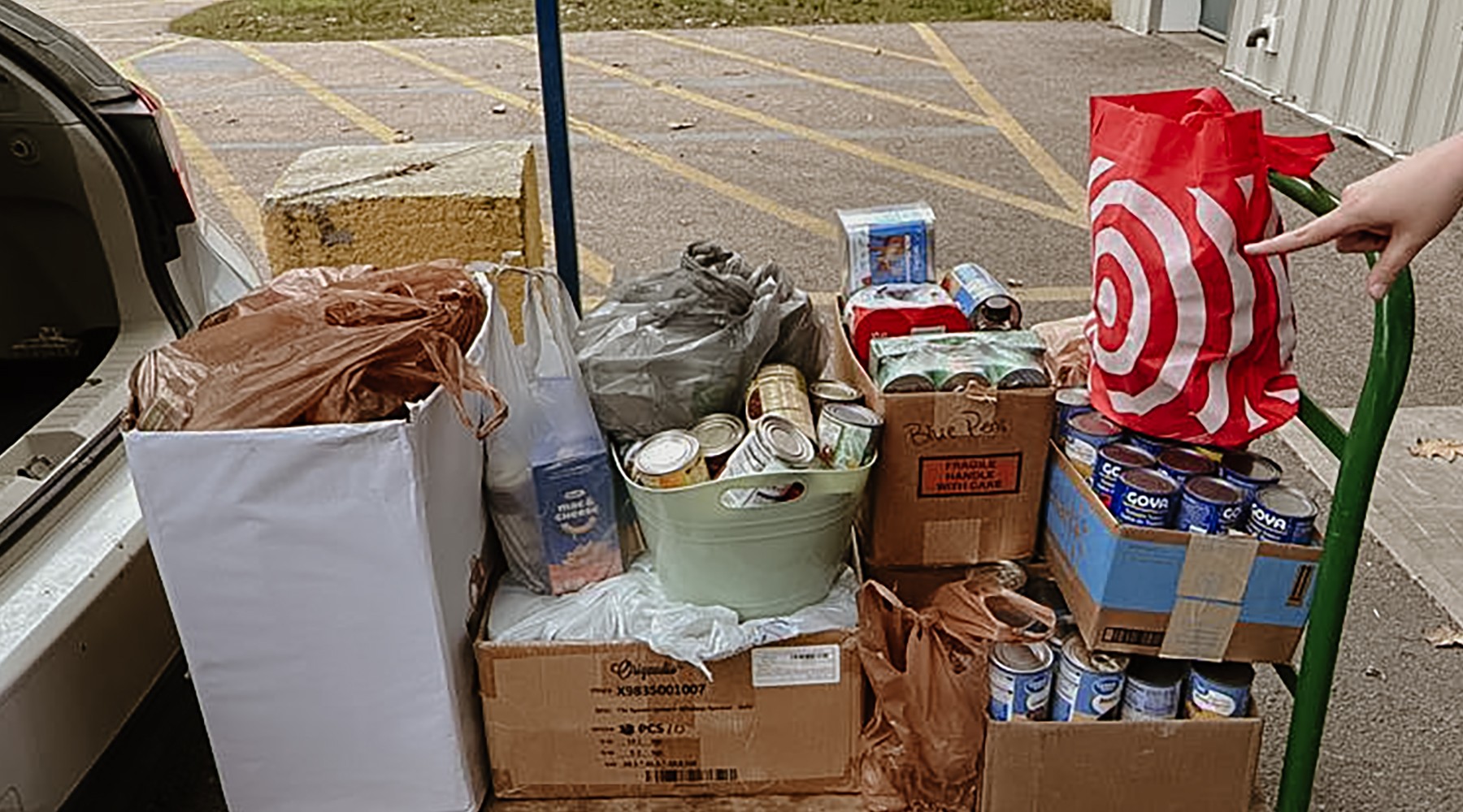 A photo of the food collected in the Manchester office being donated to the local food bank.