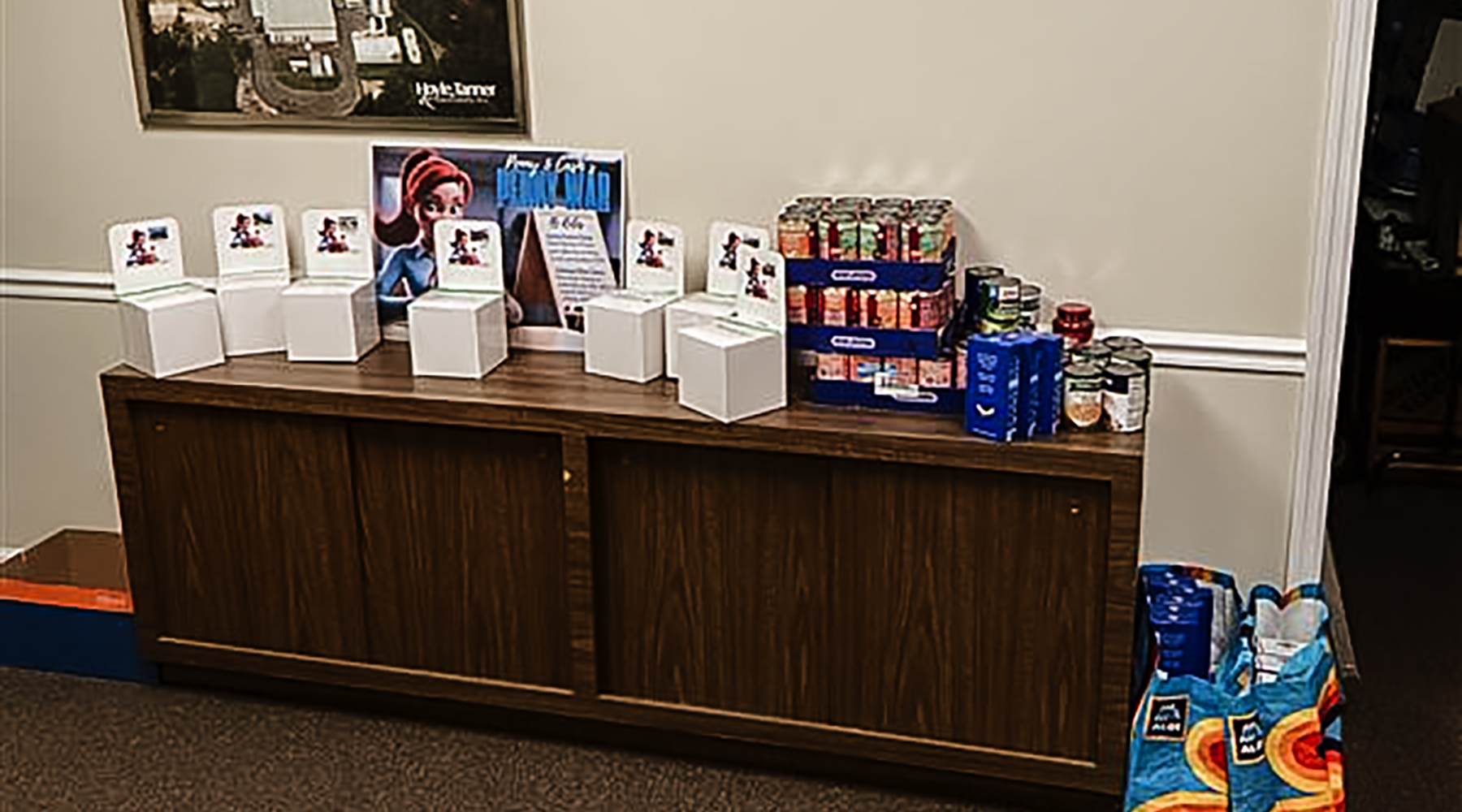 Oviedo's contribution of food donations stacked on a side table.