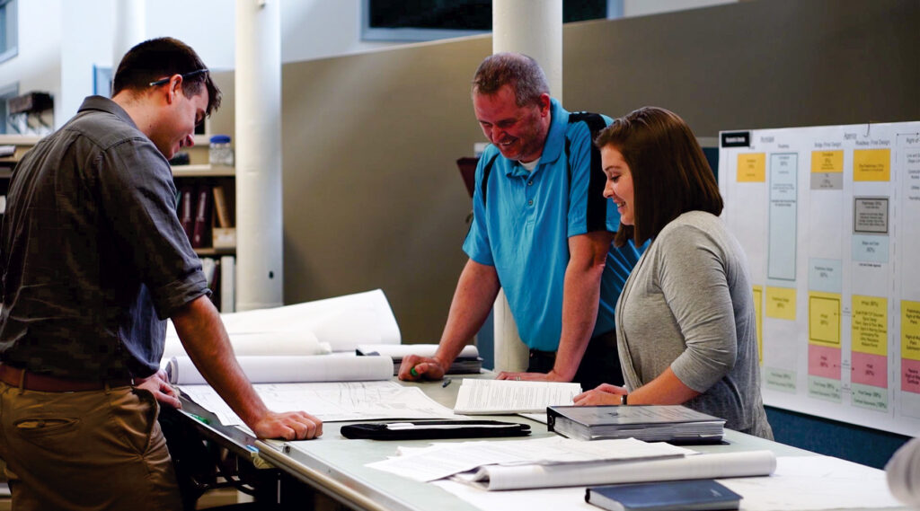 Our ground transportation team at the drafting table.