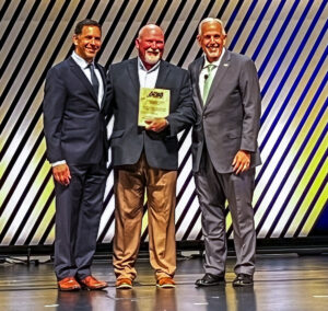 Chris Mulleavey accepting his award on stage at the APWA awards.
