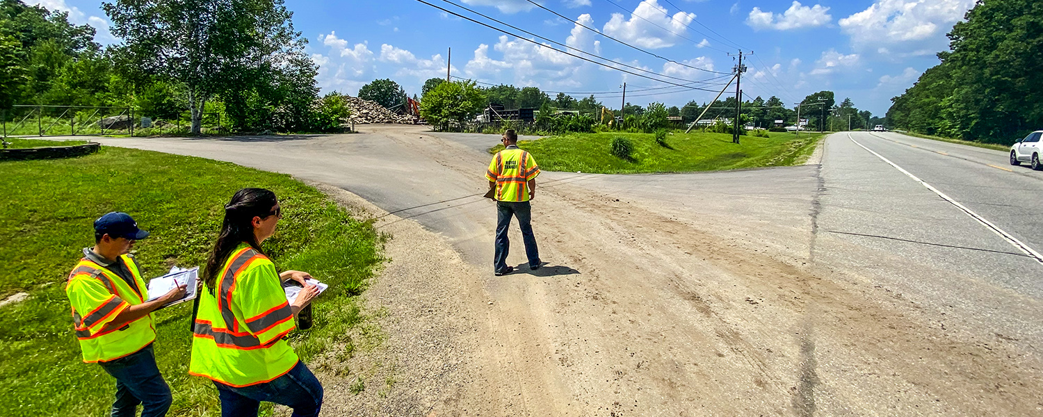 Our transportation/roadway engineers doing a road safety audit on a bright sunny day in summer.