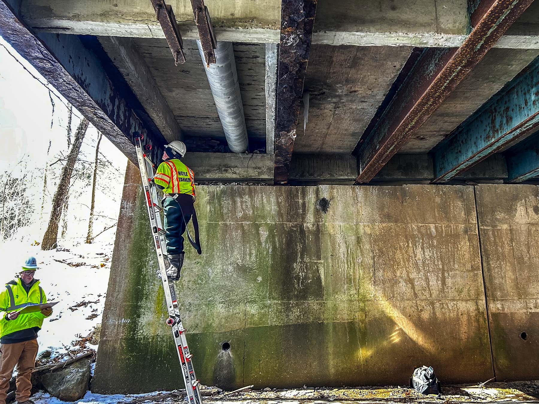 Our engineers working on inspecting a bridge in Massachusetts for MassDOT.