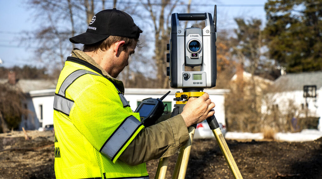 David Jeffery doing survey at residential lots in New Hampshire