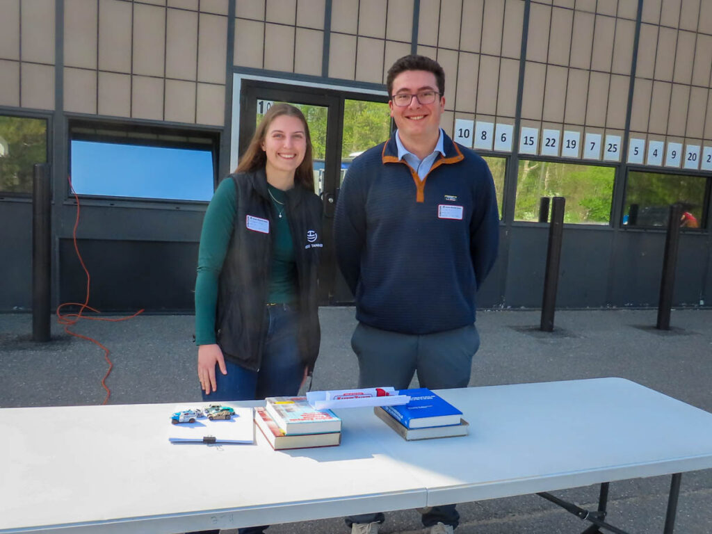Steph and Steve posing for a photo during their volunteering event about bridge engineering