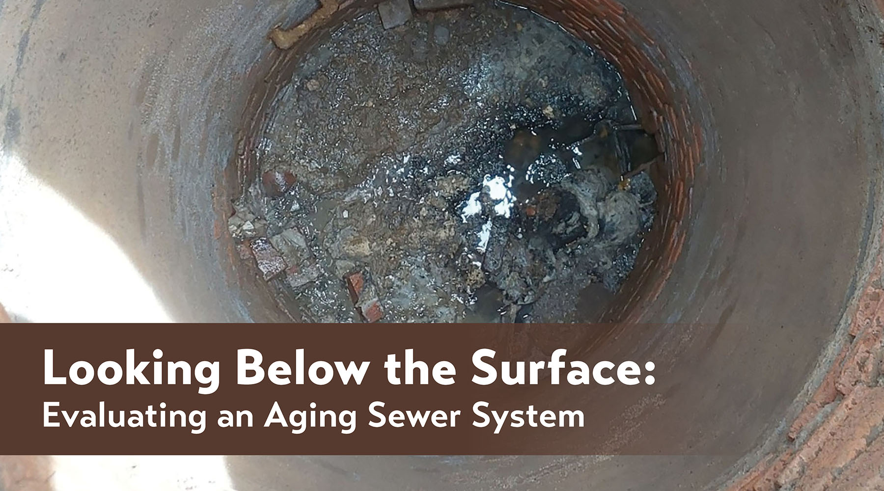 Inside a manhole. The graphic features the title of the article on top with a brown transparent background behind it.